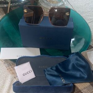Gucci Women's clear brow n tones and Gold Sunglasses